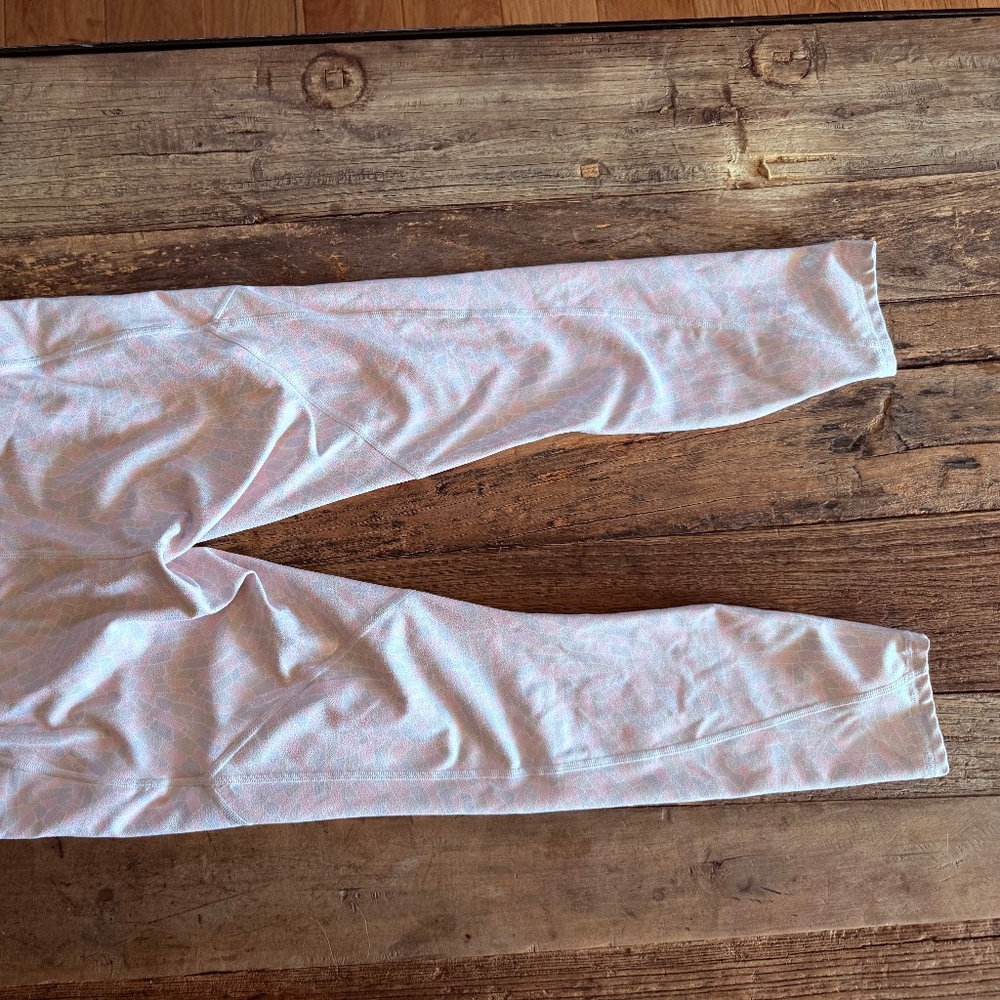 Pink Shiny Fabletics leggings with geometric shapes and shine/glitter